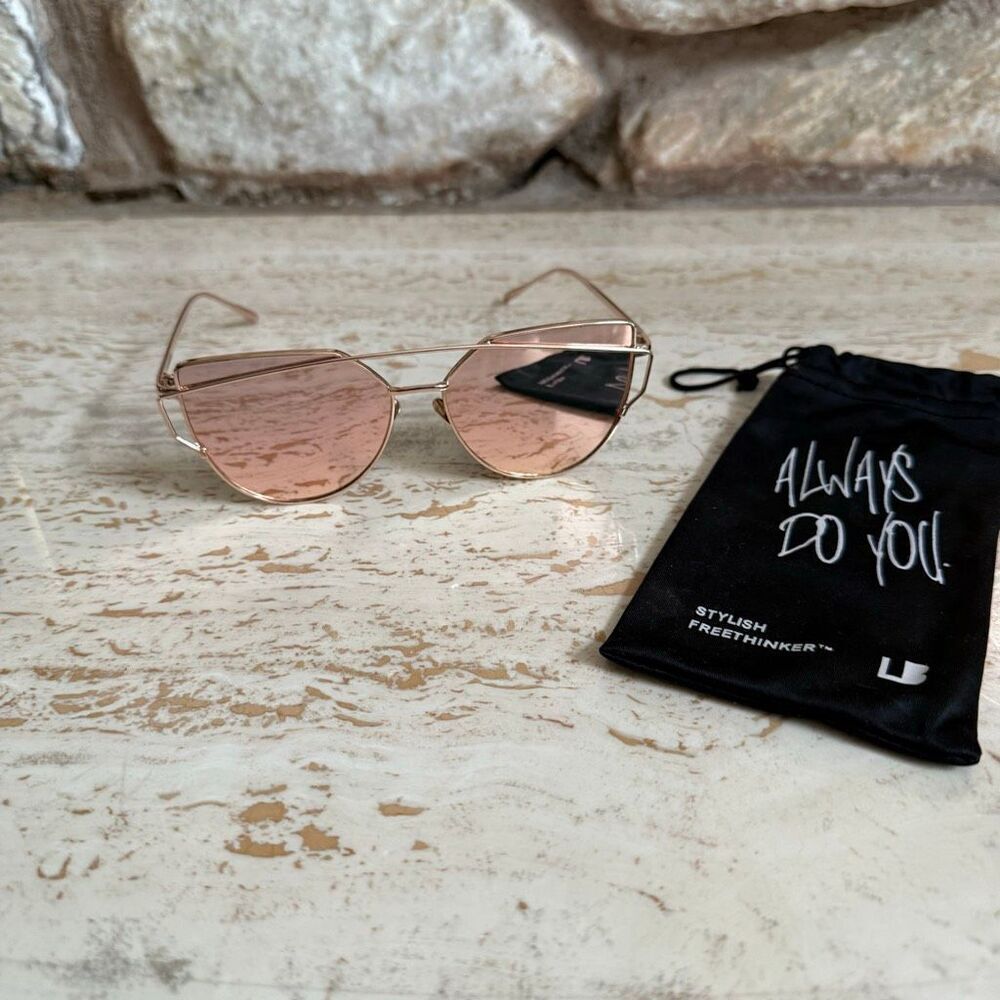 Rose gold wire frame cat eye aviator sunglasses with reflective pink  lenses.